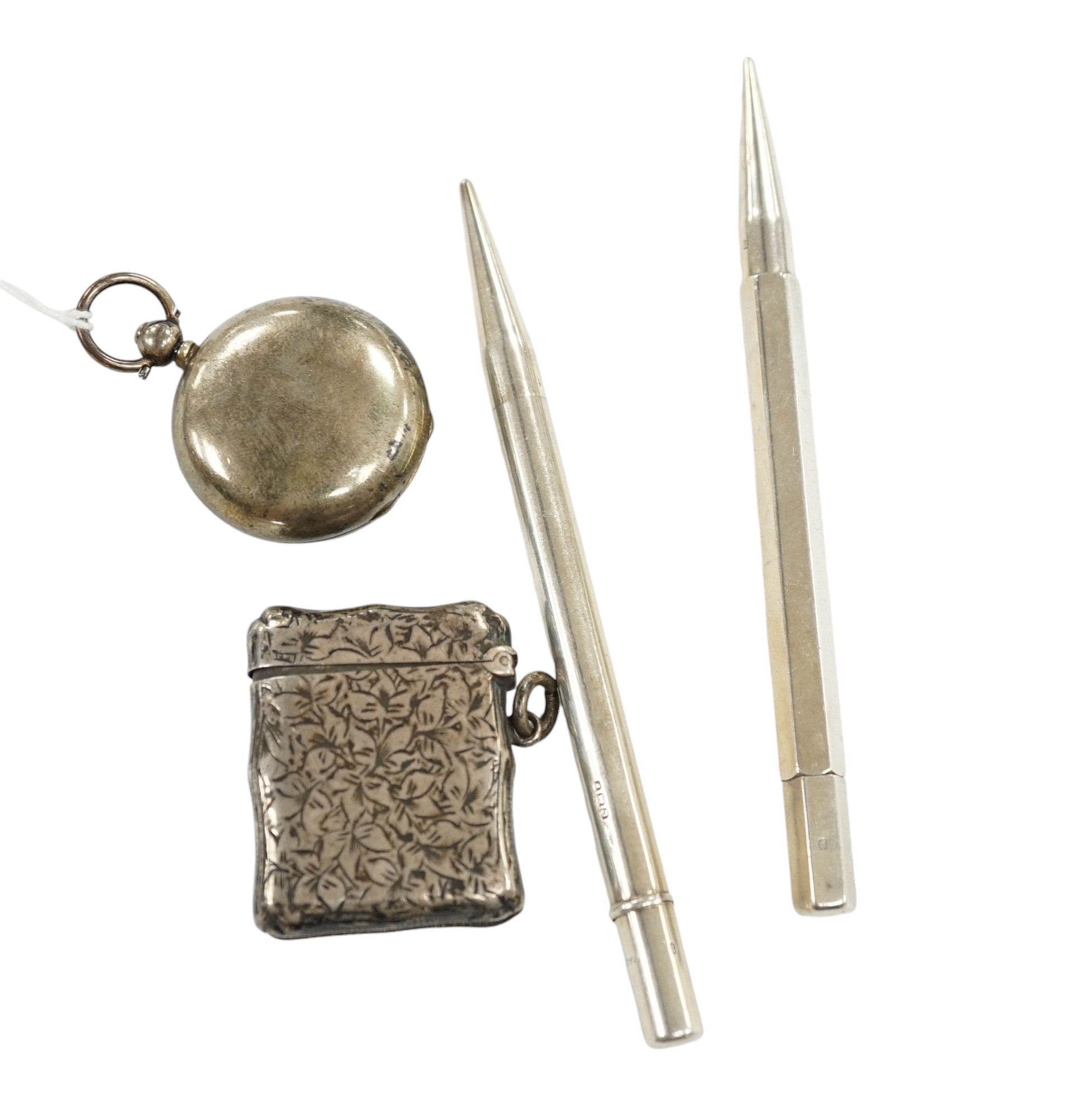 A George V silver sovereign case, a silver vesta case and two silver propelling pencils. Condition - poor to fair